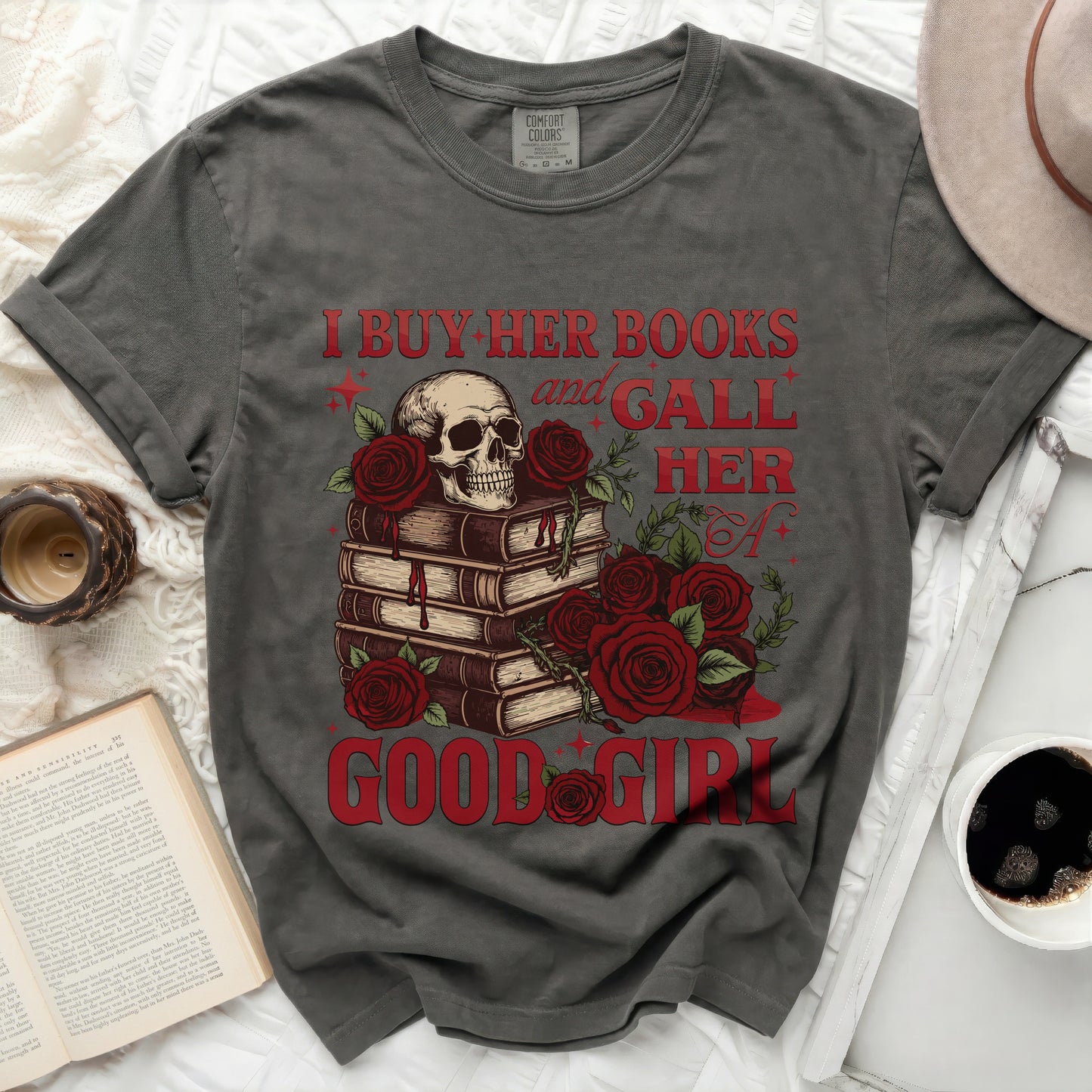Skull with roses and books, text "I BUY HER BOOKS and GALL HER A GOOD GIRL".