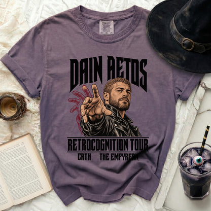 Purple t-shirt with "Dain Aetos Retrocognition Tour" graphic.