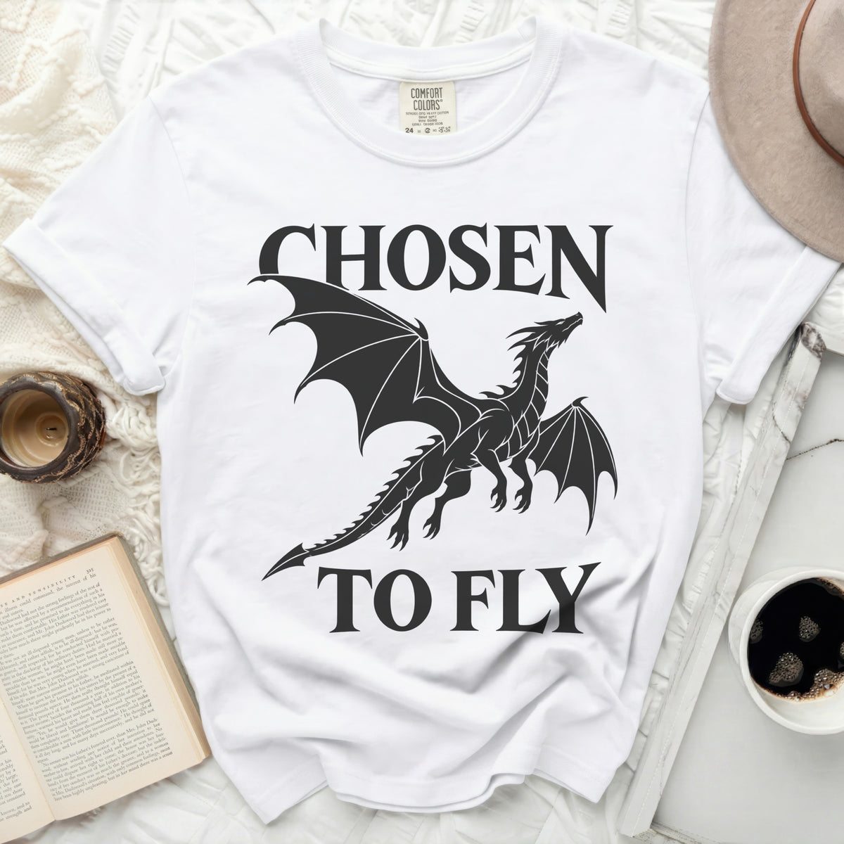 White t-shirt with black graphic of a dragon and text "CHOSEN TO FLY".