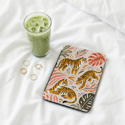 Tablet case with a beige background featuring tiger illustrations and tropical leaves.
