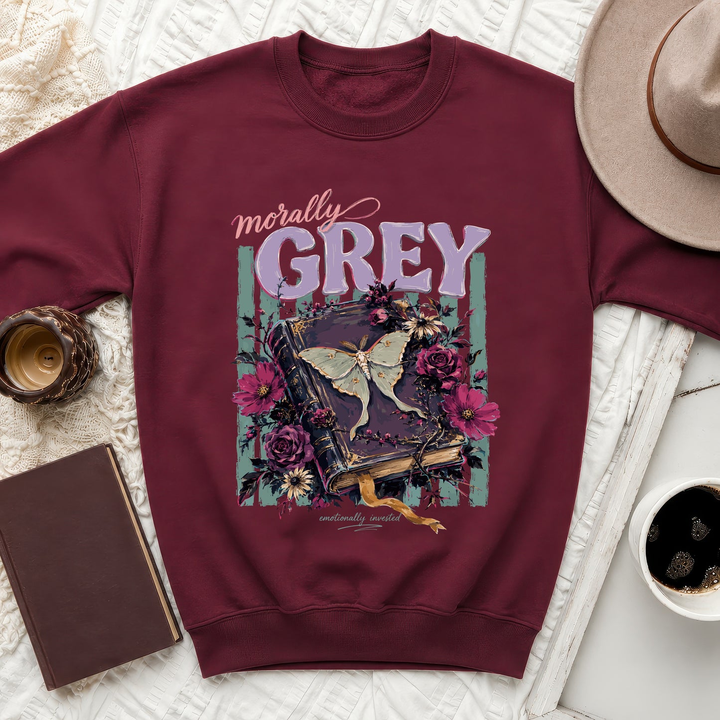 Burgundy sweatshirt with "morally GREY" and moth on a book design.