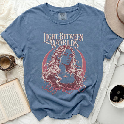 Blue t-shirt with "Light Between Worlds" and Bryce Quinlan graphic.