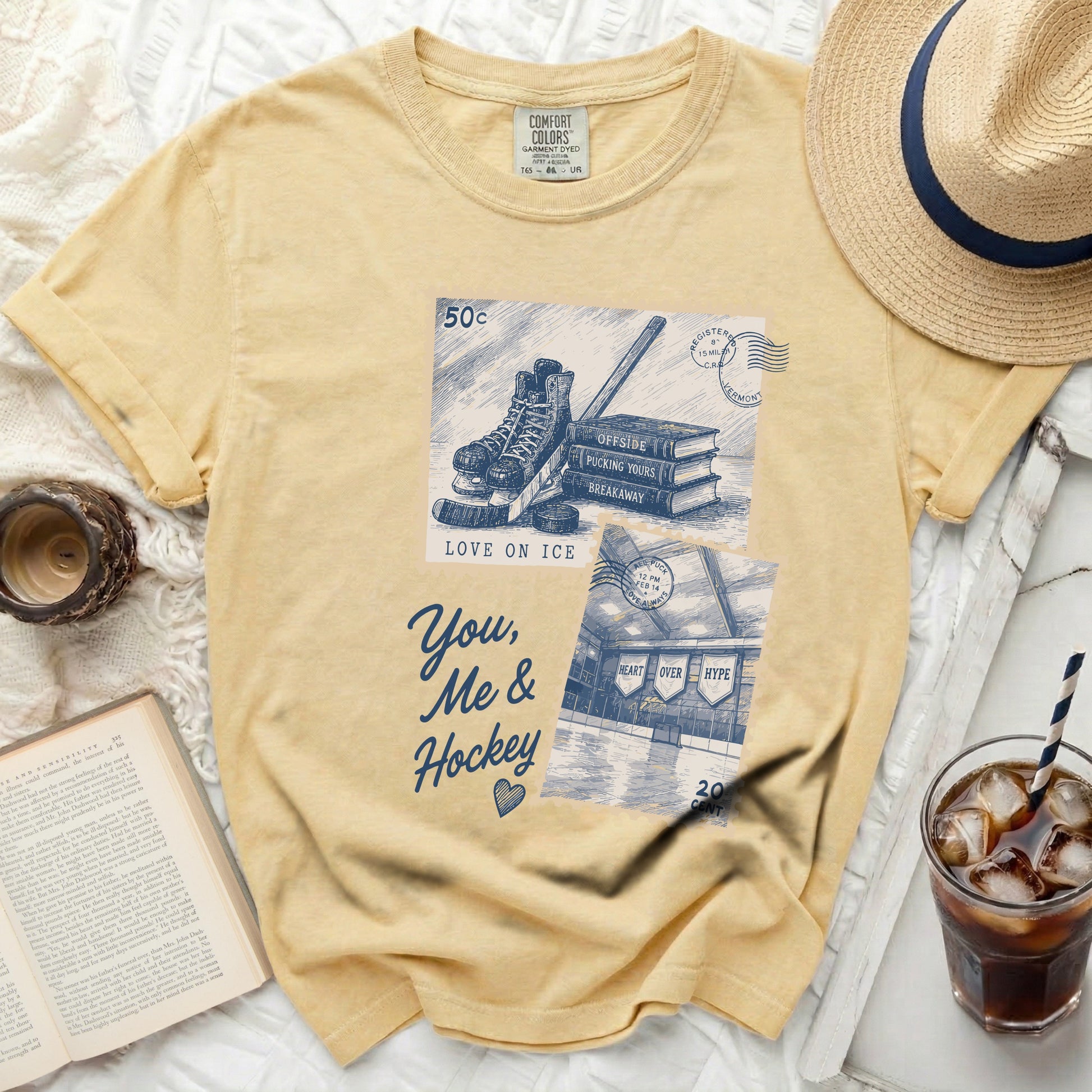 Yellow t-shirt with "You, Me & Hockey" graphic featuring skates and hockey elements.