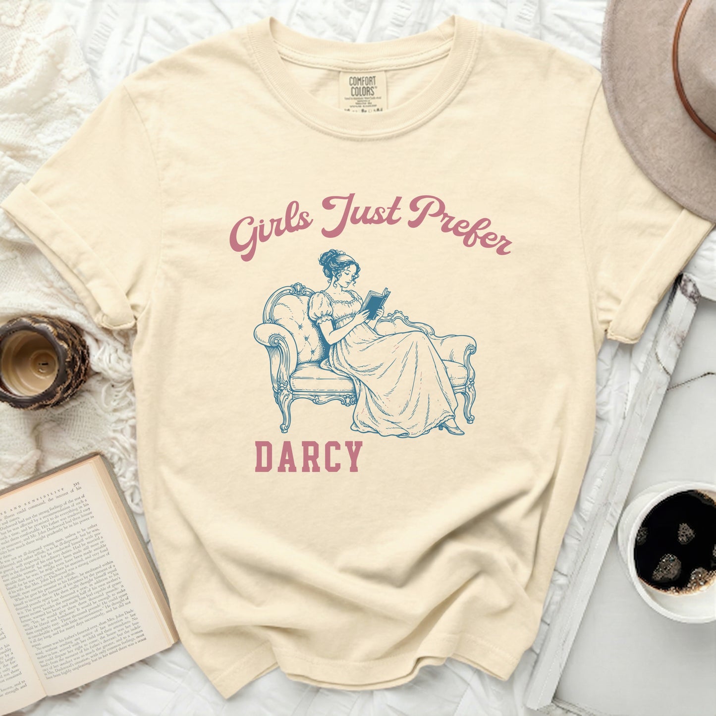 Cream t-shirt with "Girls Just Prefer Darcy" inscribed.