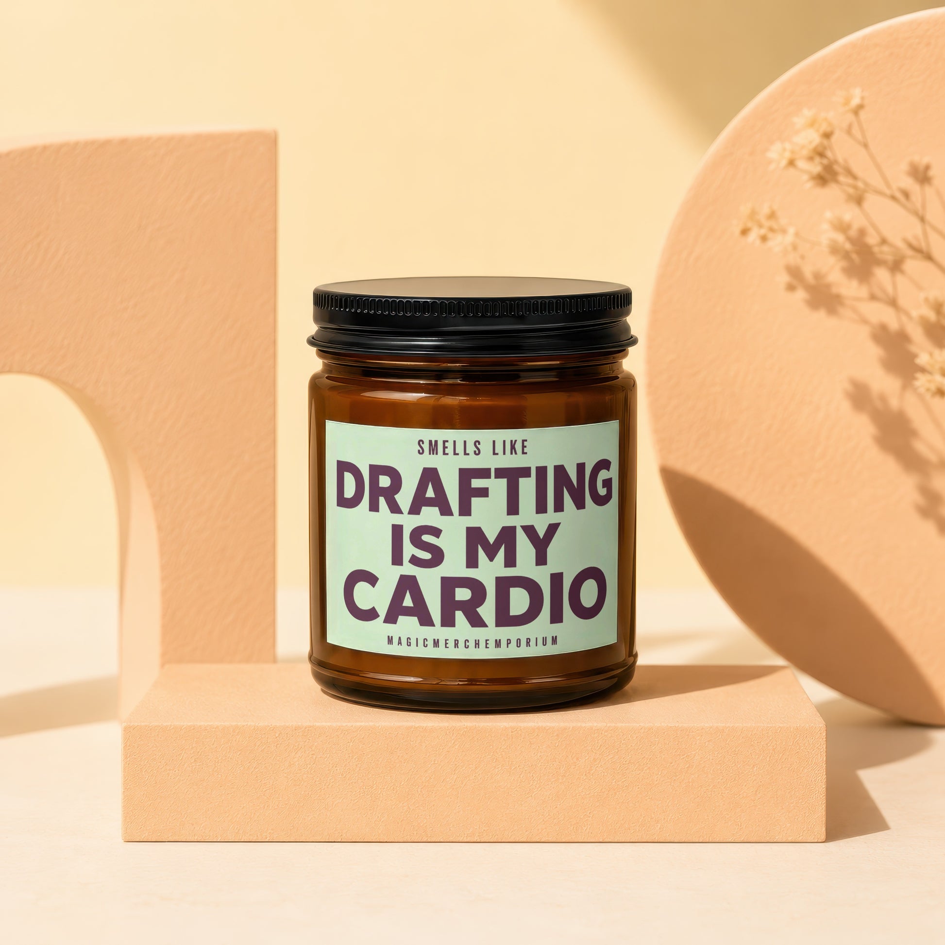 Brown candle in jar with "Smells like Drafting is my Cardio" label.