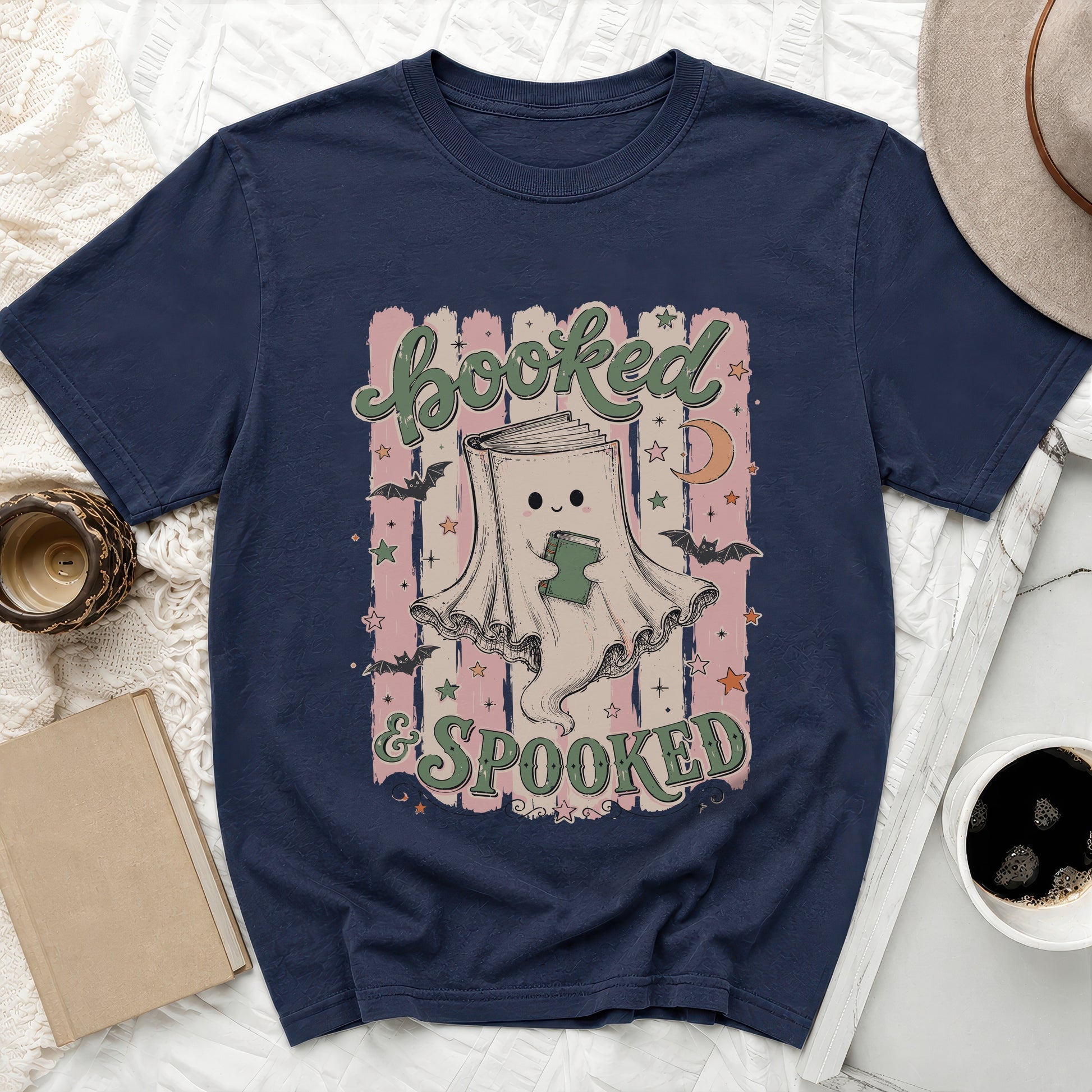 Navy shirt with a graphic reading "Booked & Spooked" featuring a ghost book character.