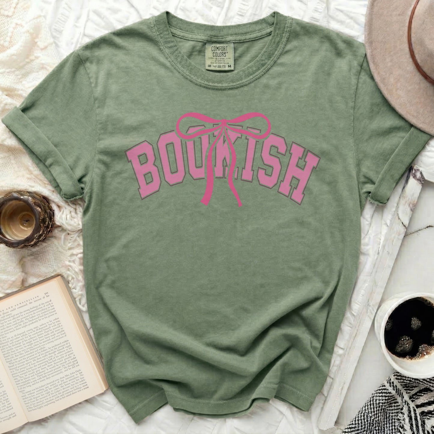 Comfort Colors green t-shirt with pink "BOUKISH" and bow graphic.