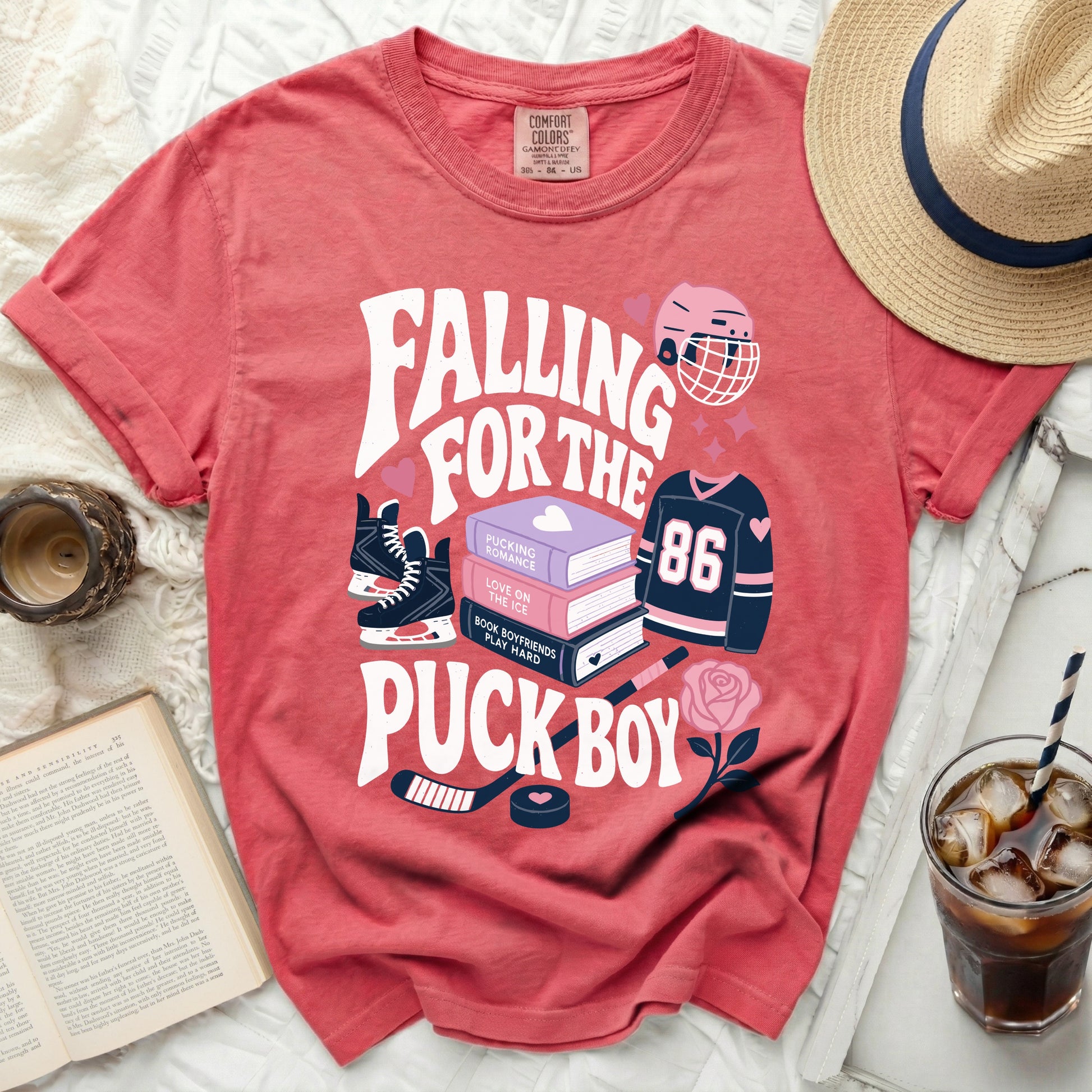 Red t-shirt with "Falling for the Puck Boy" hockey graphic.