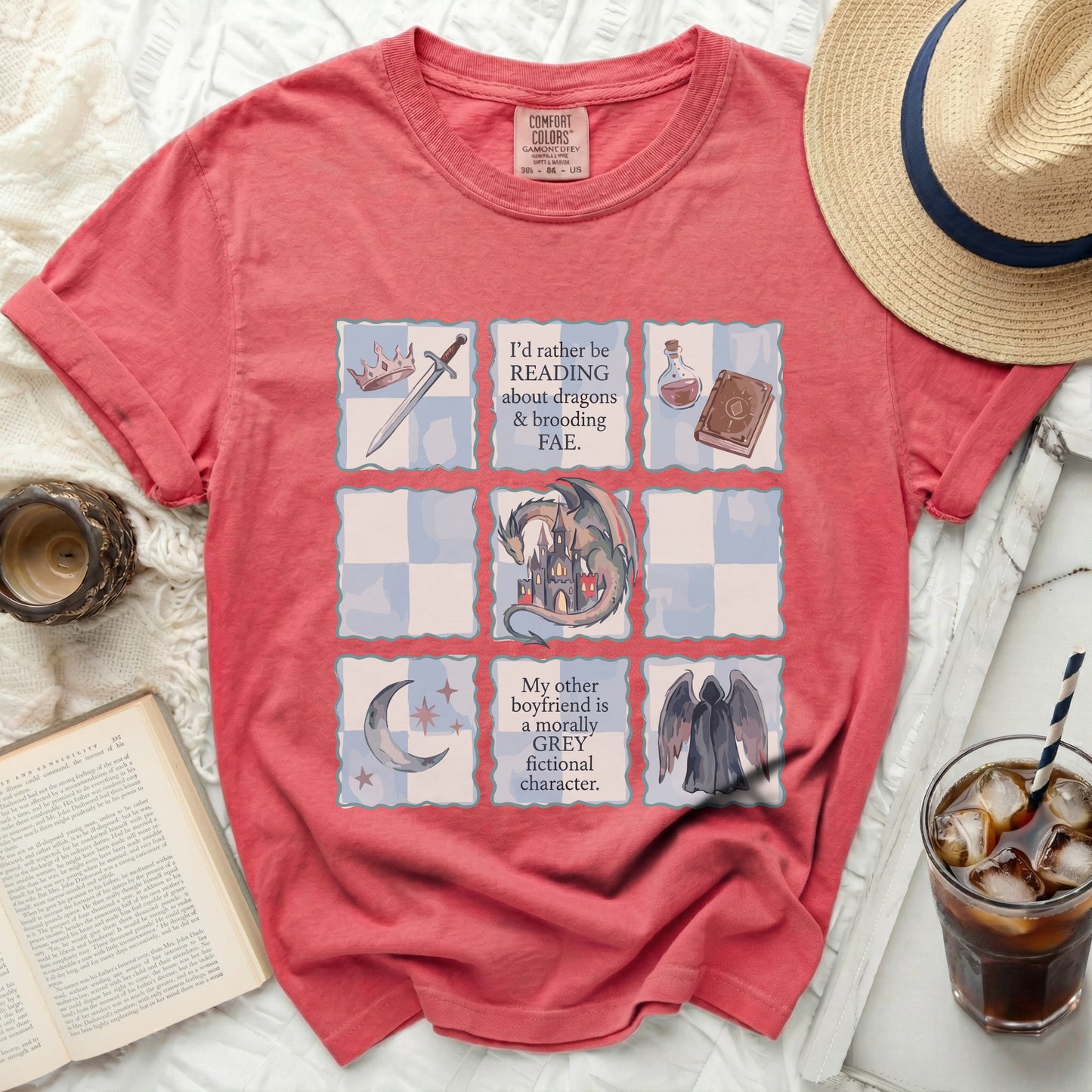 Coral t-shirt with grid graphic and fantasy text.