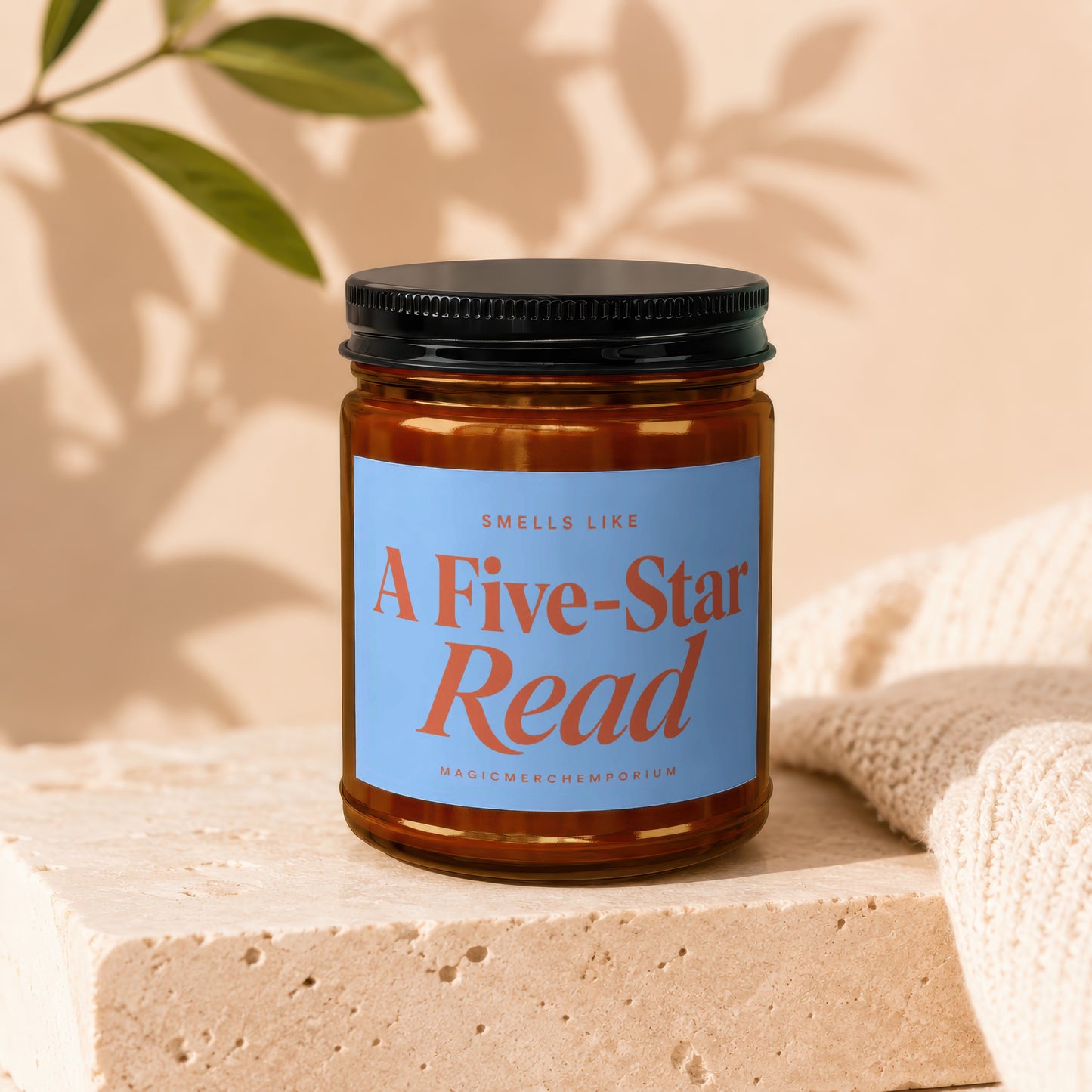 Amber jar candle with "Smells Like A Five-Star Read" label and "MagicMerchEmporium" text.