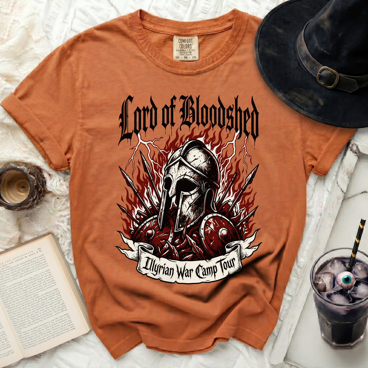 Orange t-shirt with "Lord of Bloodshed" and "Illyrian War Camp Tour" graphic.