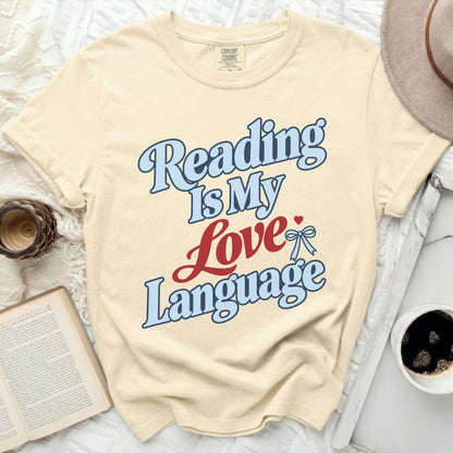 Cream t-shirt with "Reading Is My Love Language" text in blue and red.