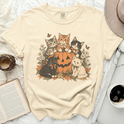 Cream t-shirt with five kittens and a pumpkin graphic with butterflies and flowers.
