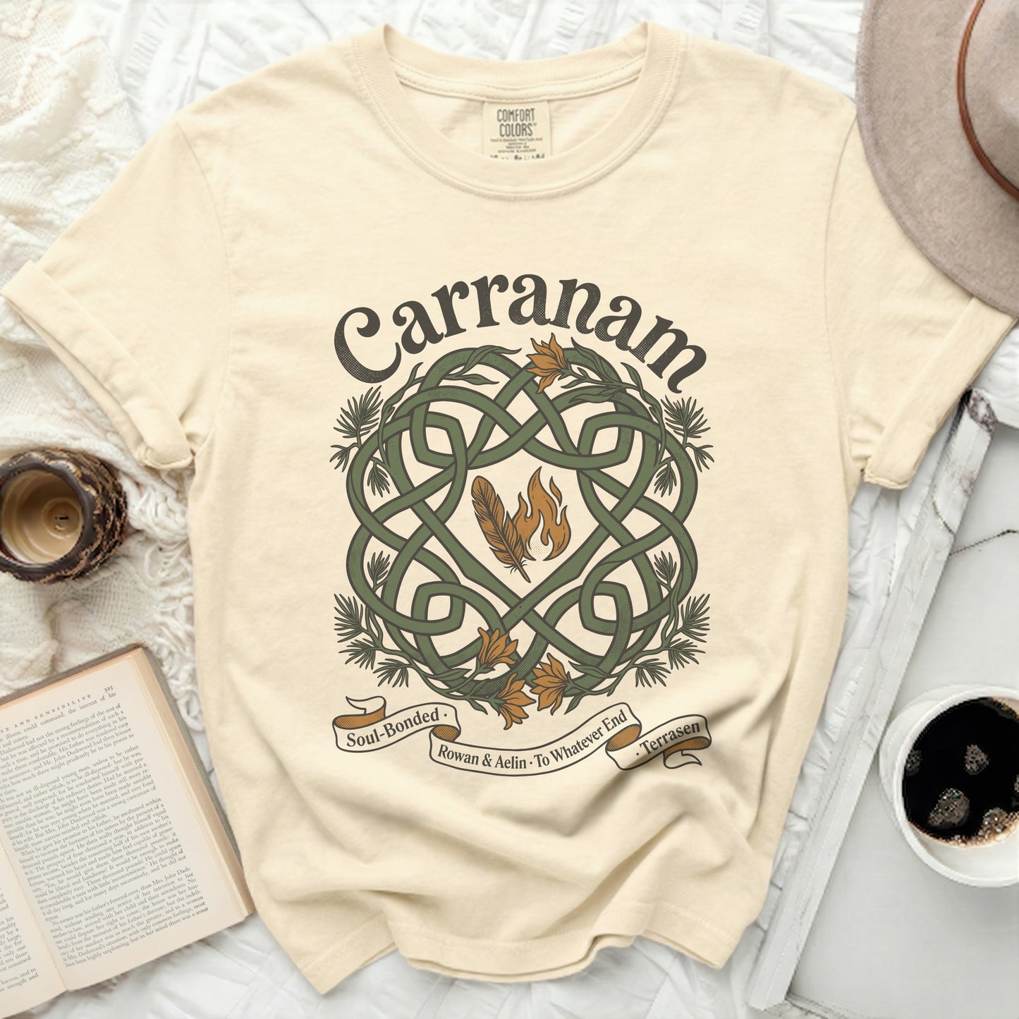 Cream t-shirt with Celtic knot and flames design, "Carranam" text.
