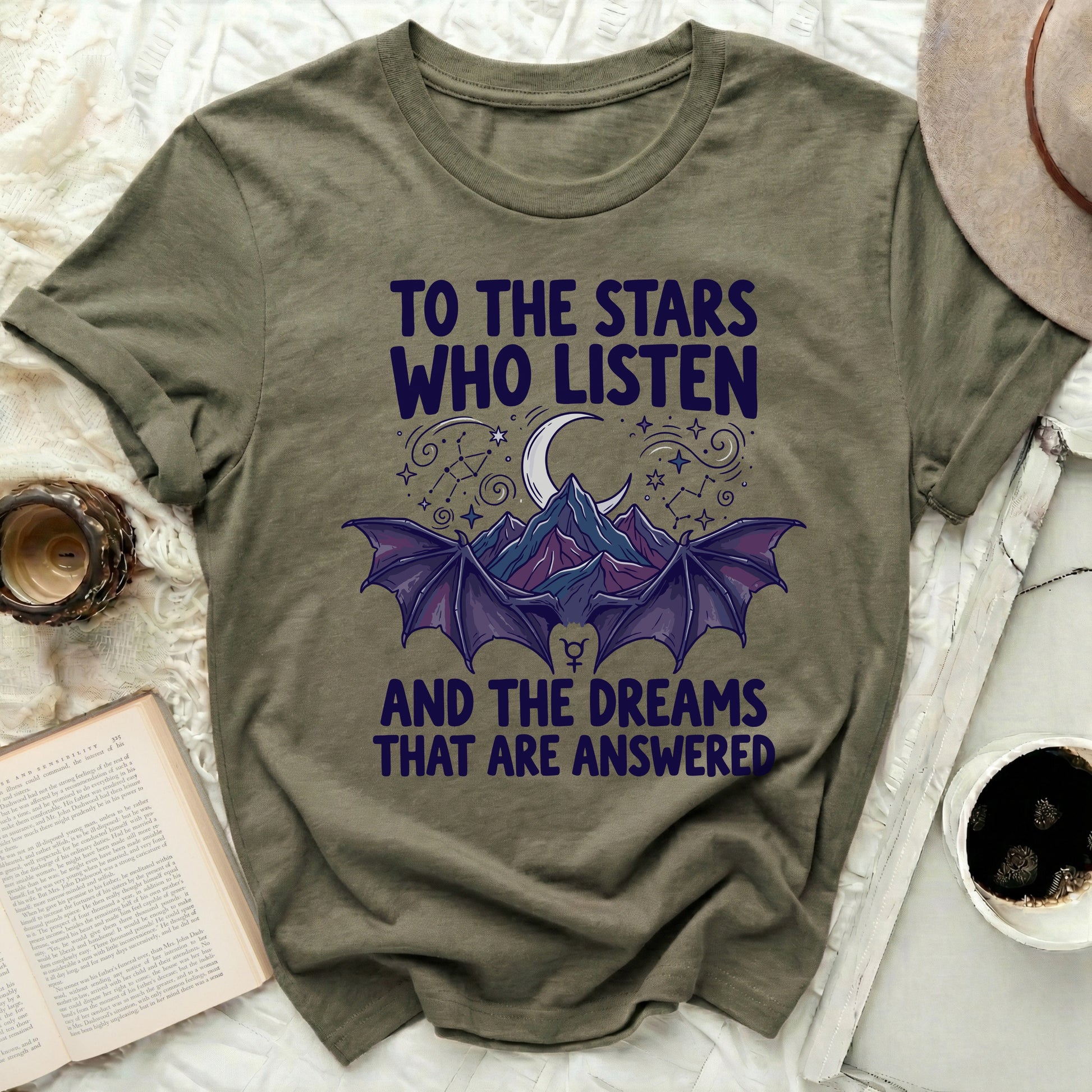 To The Stars Who Listen And The Dreams Answered product type
Stars Listen, Dreams Answered, Celestial Design, Moon Graphic, Bat Wings, Mountain Art, Night Sky Theme, Goth Style, Mystical Shirt, Fantasy Wear, Inspirational Quote, Graphic Tee, Dark Aesthetic, Witchy Vibes, Unique Design, Cosmic, Spiritual Theme, Crescent Moon, Bat Creature, T-Shirt