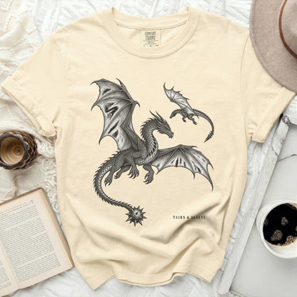 T-shirt with a black ink drawing of two dragons, one large and one small, with text "TAIRN & SGAEYL".
