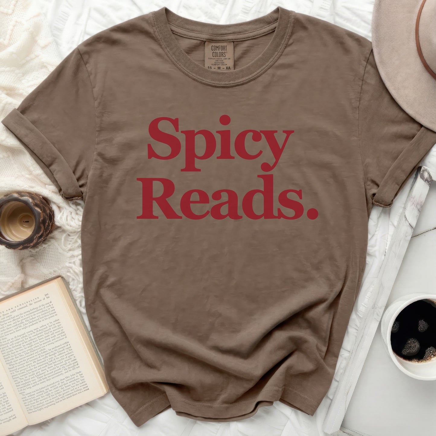 Brown t-shirt with red text "Spicy Reads."