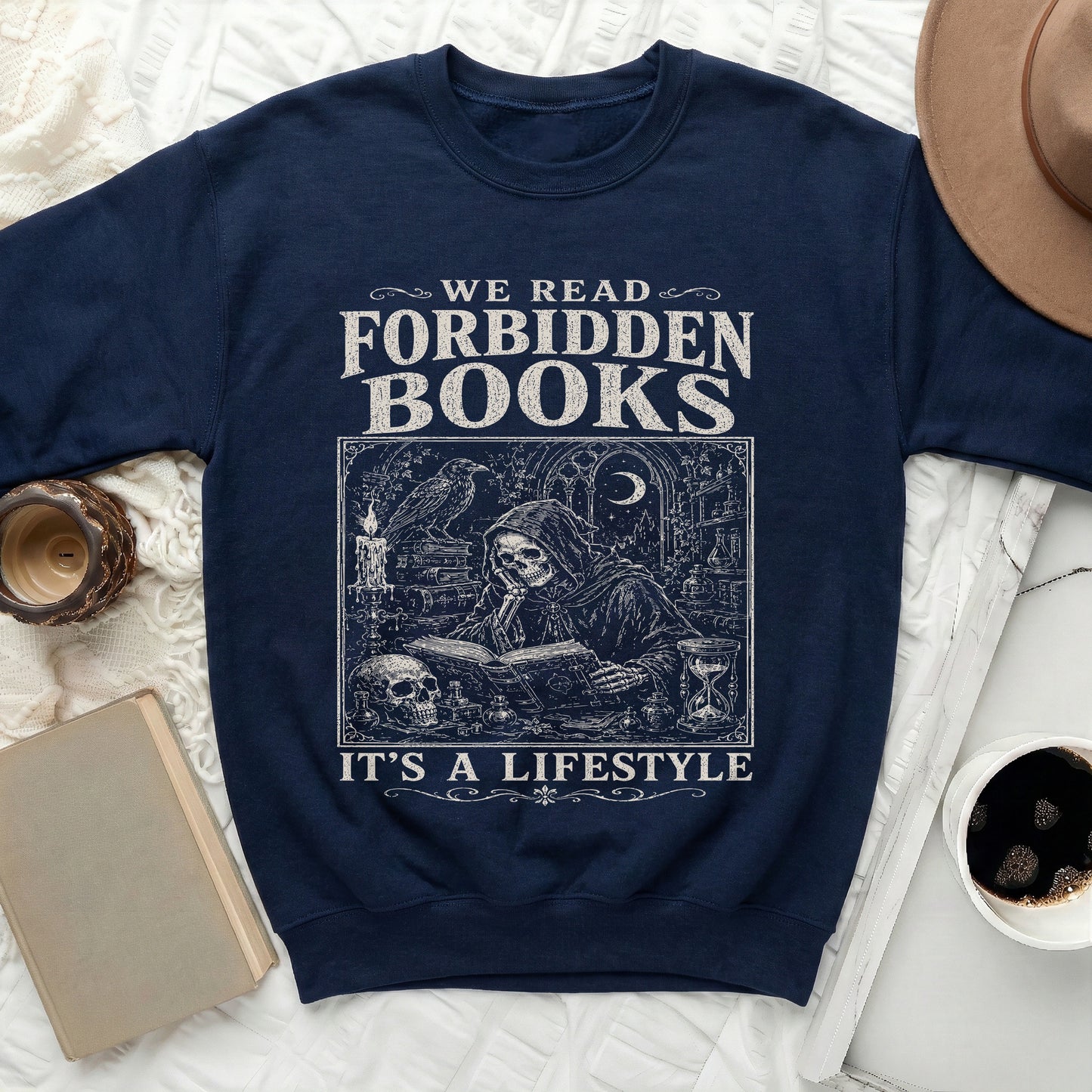 Navy sweatshirt with "We Read Forbidden Books It's a Lifestyle" text and gothic illustration.