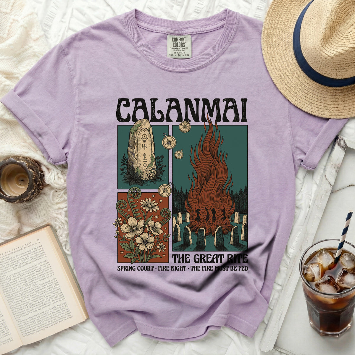 CALANMAI t-shirt with graphics of runes, flowers, and a fire ritual.