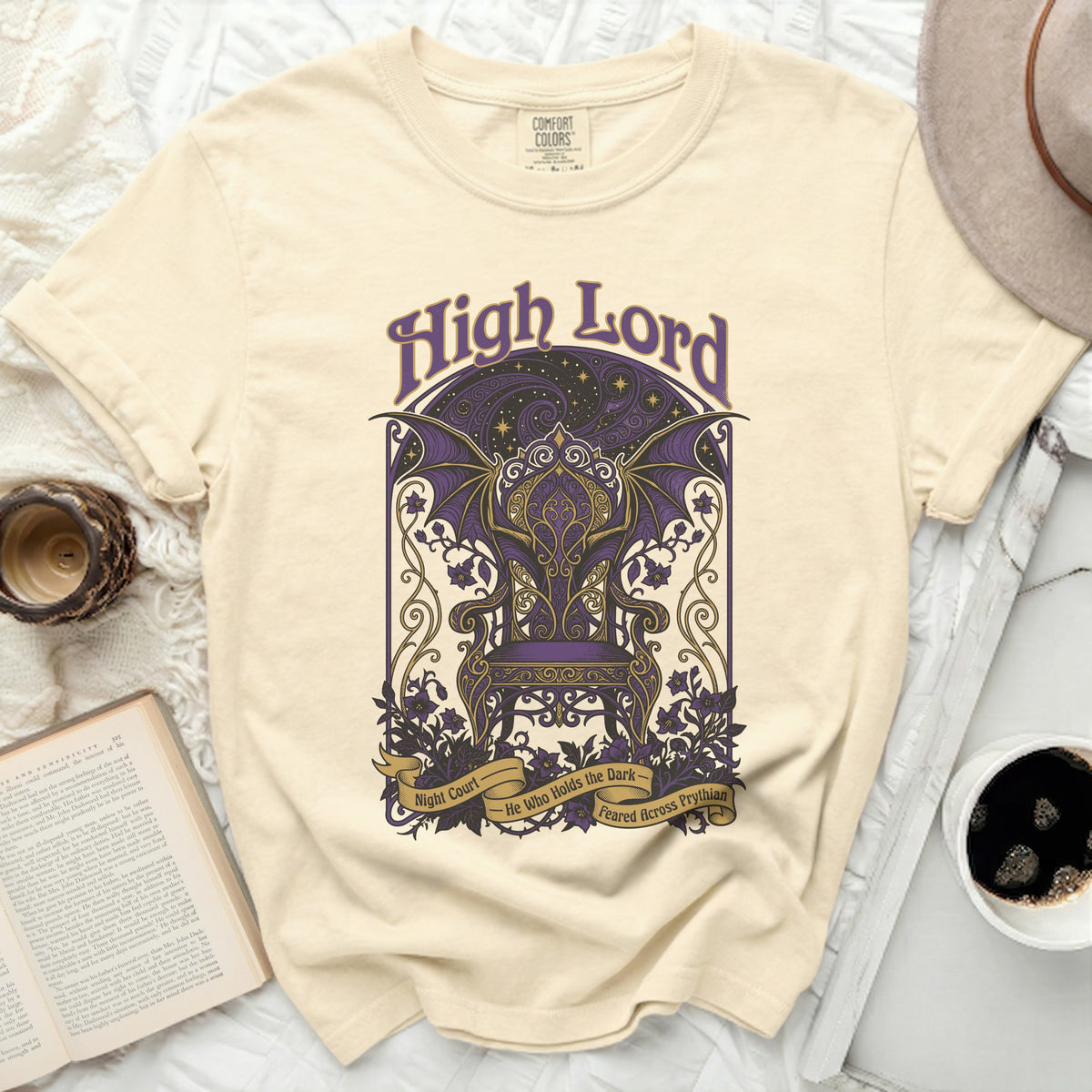 Cream t-shirt with "High Lord" graphic featuring a purple throne and bat wings.