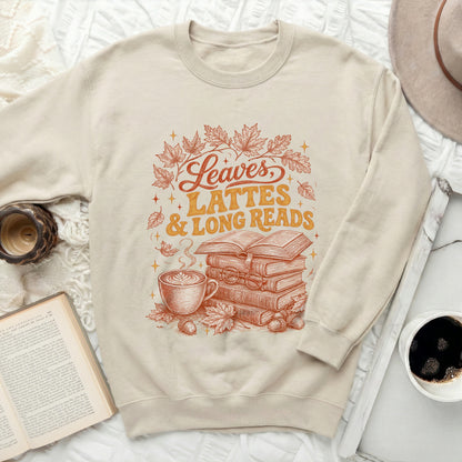 Cream sweatshirt with "Leaves, Lattes & Long Reads" autumn graphic.
