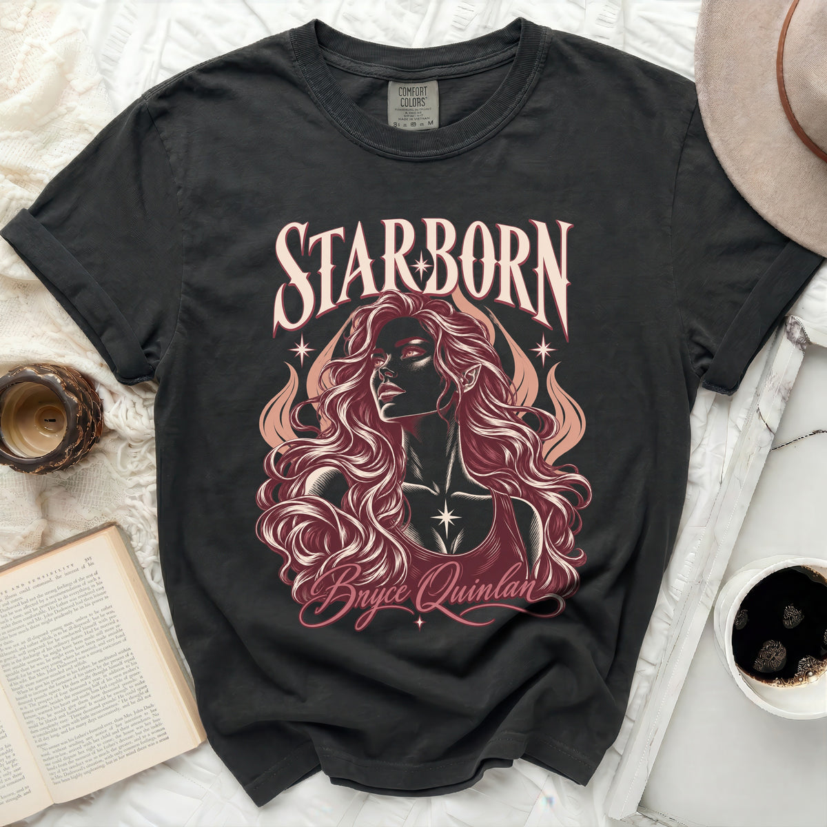 Dark t-shirt with "STARBORN Bryce Quinlan" text and illustration of a woman.