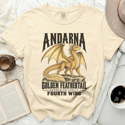 Cream t-shirt with a golden dragon graphic and text: Andarna, Golden Feathertail, Bonded to Violet, Fourth Wing.