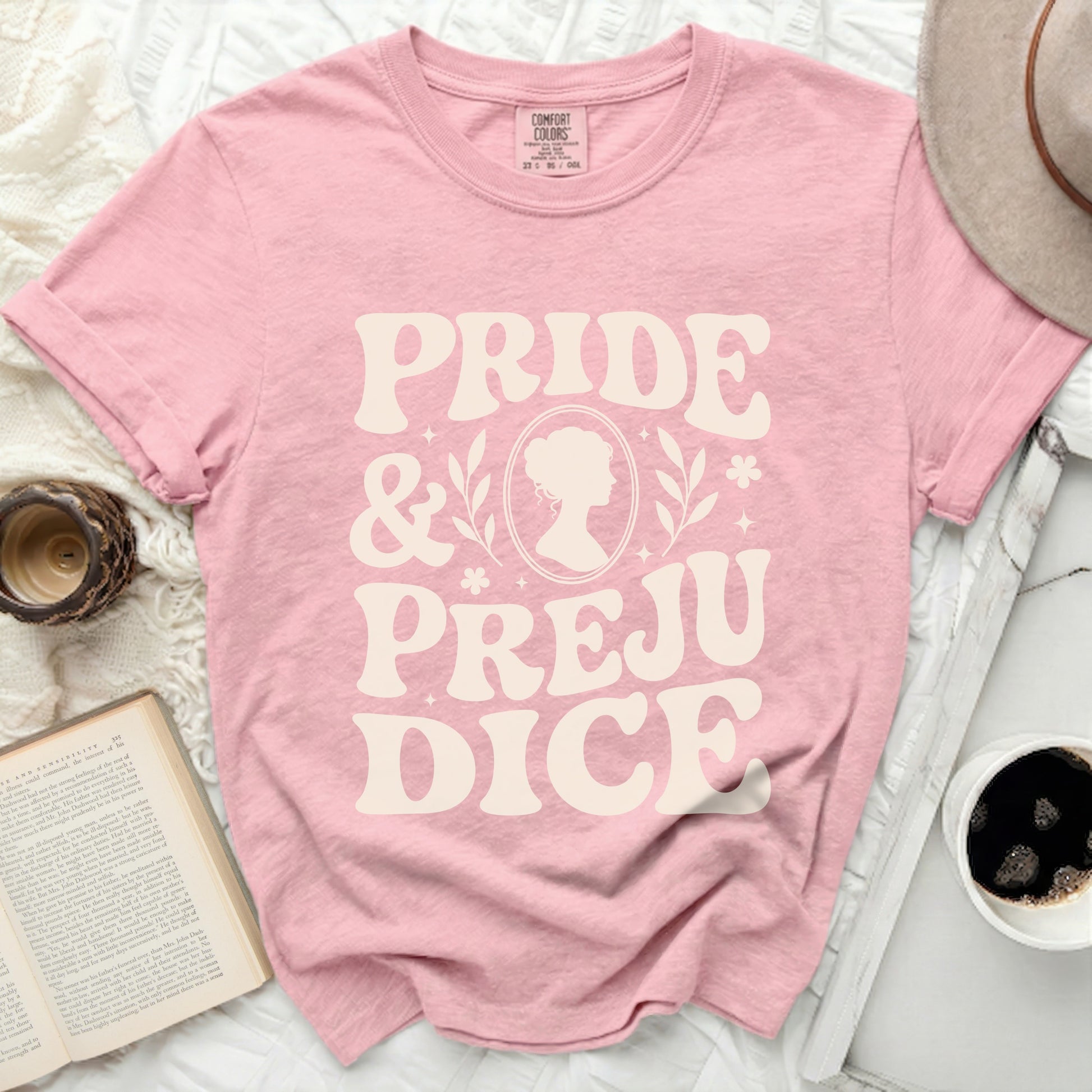 Pink Comfort Colors t-shirt with "Pride & Prejudice" and silhouette graphic.