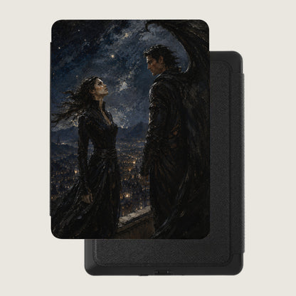 Book cover art with a winged male and female standing over a city at night.