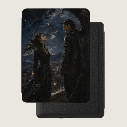 Book cover art with a winged male and female standing over a city at night.