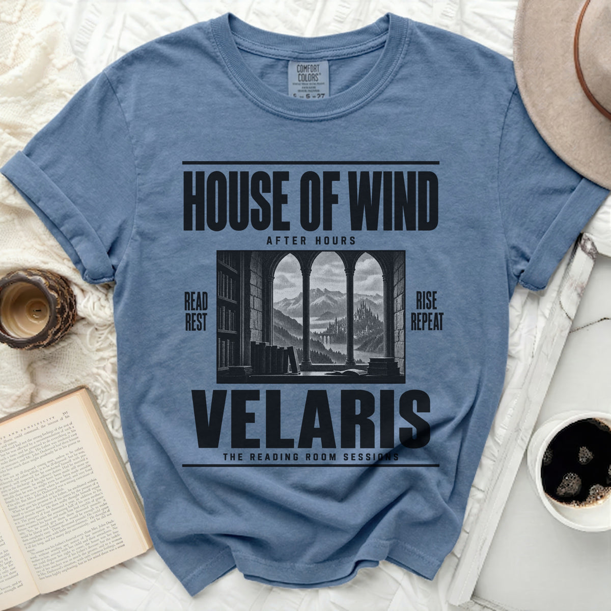 Blue t-shirt with "House of Wind After Hours Velaris The Reading Room Sessions" text and graphic.