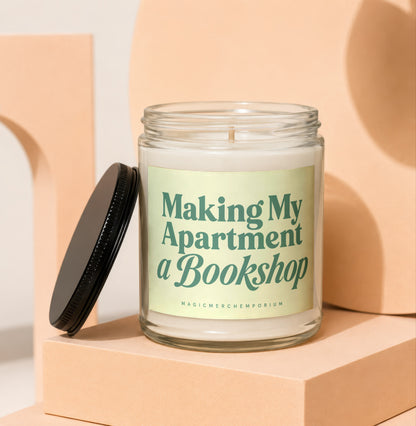 Glass candle with black lid and label reading "Making My Apartment a Bookshop".