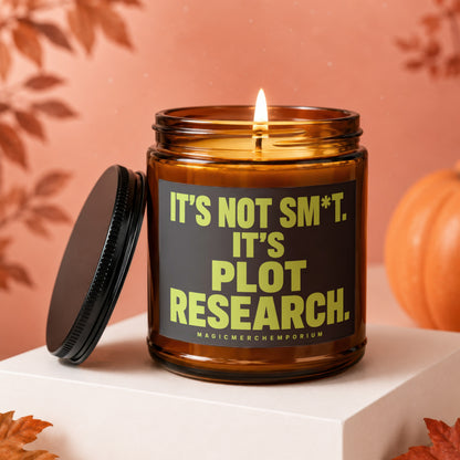 Amber candle with "It's Not Sm*t. It's Plot Research." text and "MagicMerchEmporium".
