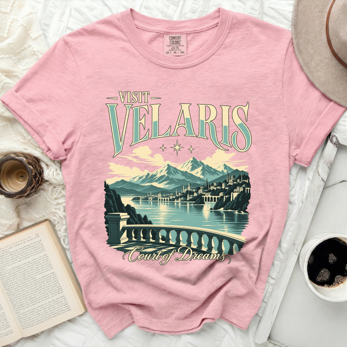 Pink t-shirt with "Visit Velaris Court of Dreams" graphic.