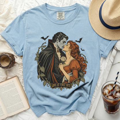 Light blue t-shirt with gothic romance graphic and "Love At First Bite" text.