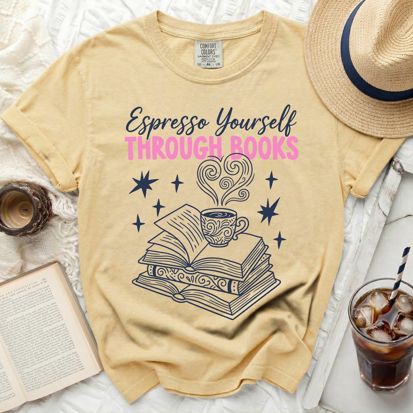 Yellow t-shirt with "Espresso Yourself Through Books" text and book illustration.