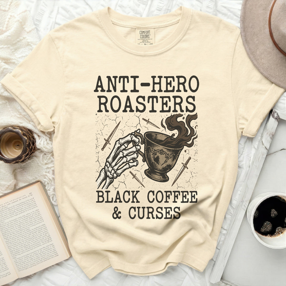 Anti-Hero Roasters black coffee and curses t-shirt with skeleton hand.