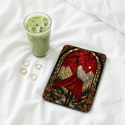 Tablet case with stained glass art of a crowned figure and dragons.
