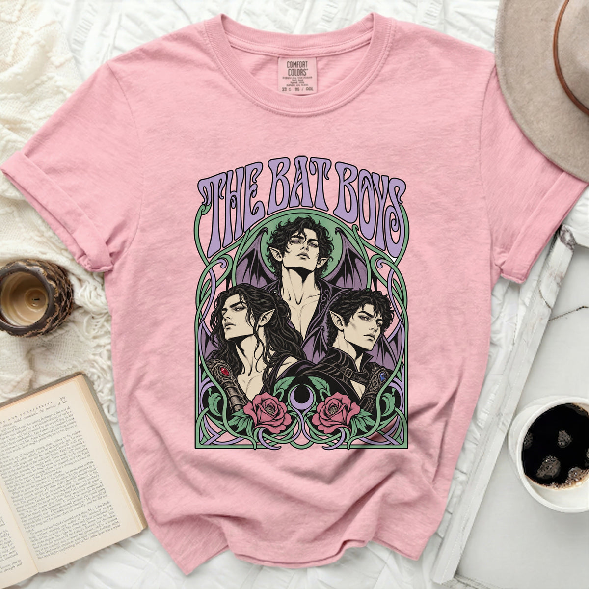 Pink t-shirt featuring "The Bat Boys" art with three men, wings, and roses.