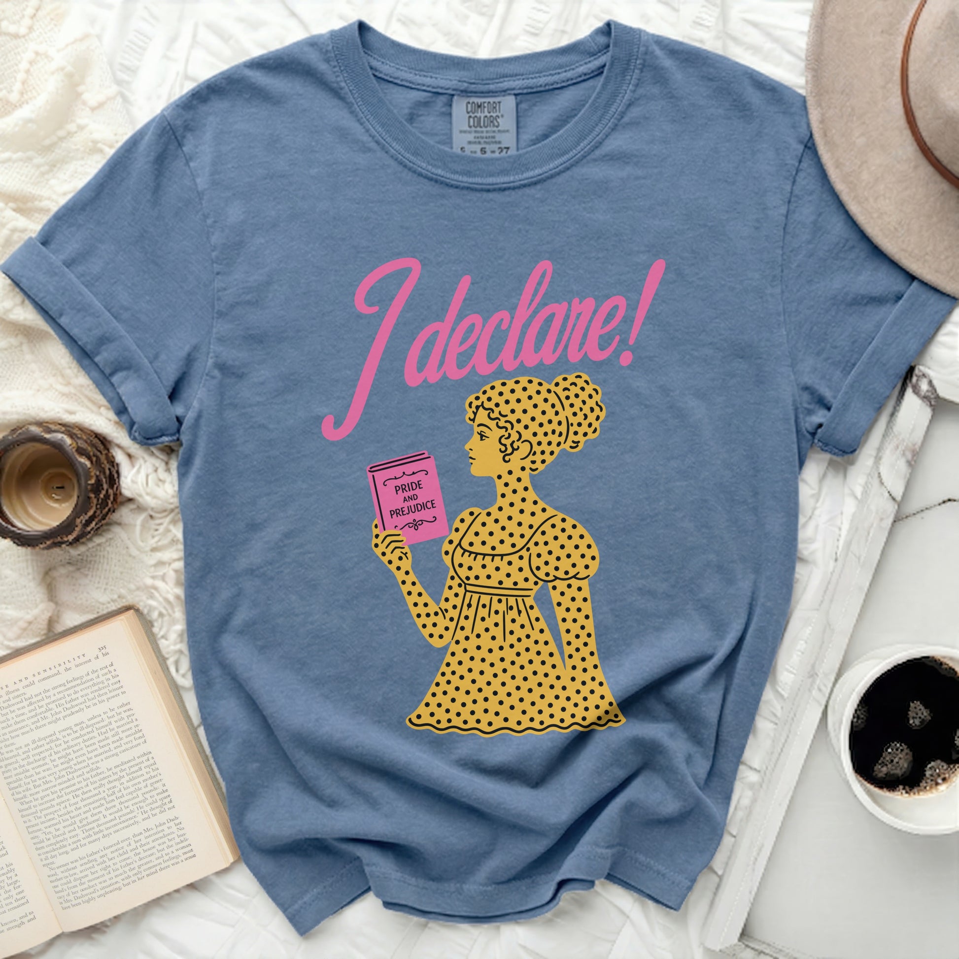 Blue t-shirt with "I declare!" and woman holding "Pride and Prejudice"
