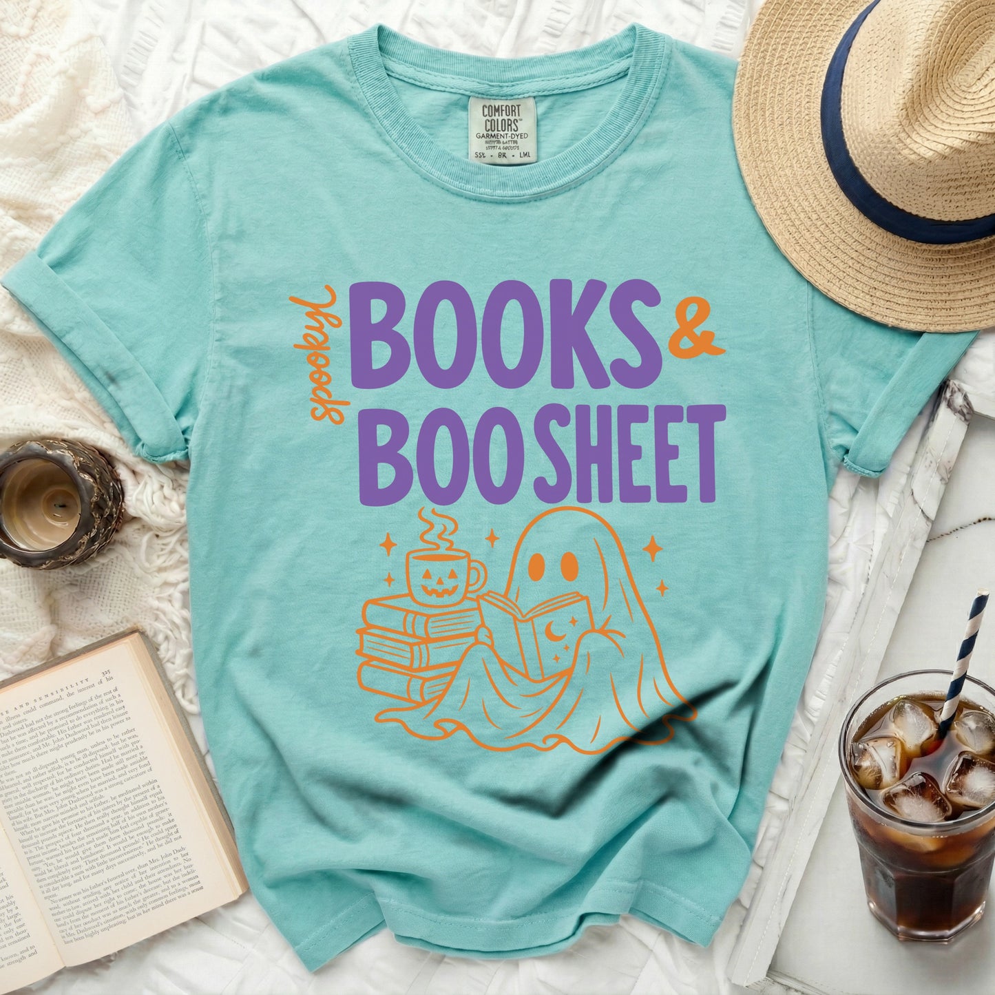 Teal Comfort Colors t-shirt with orange ghost reading and "Spooky Books & Boo Sheet" graphic.