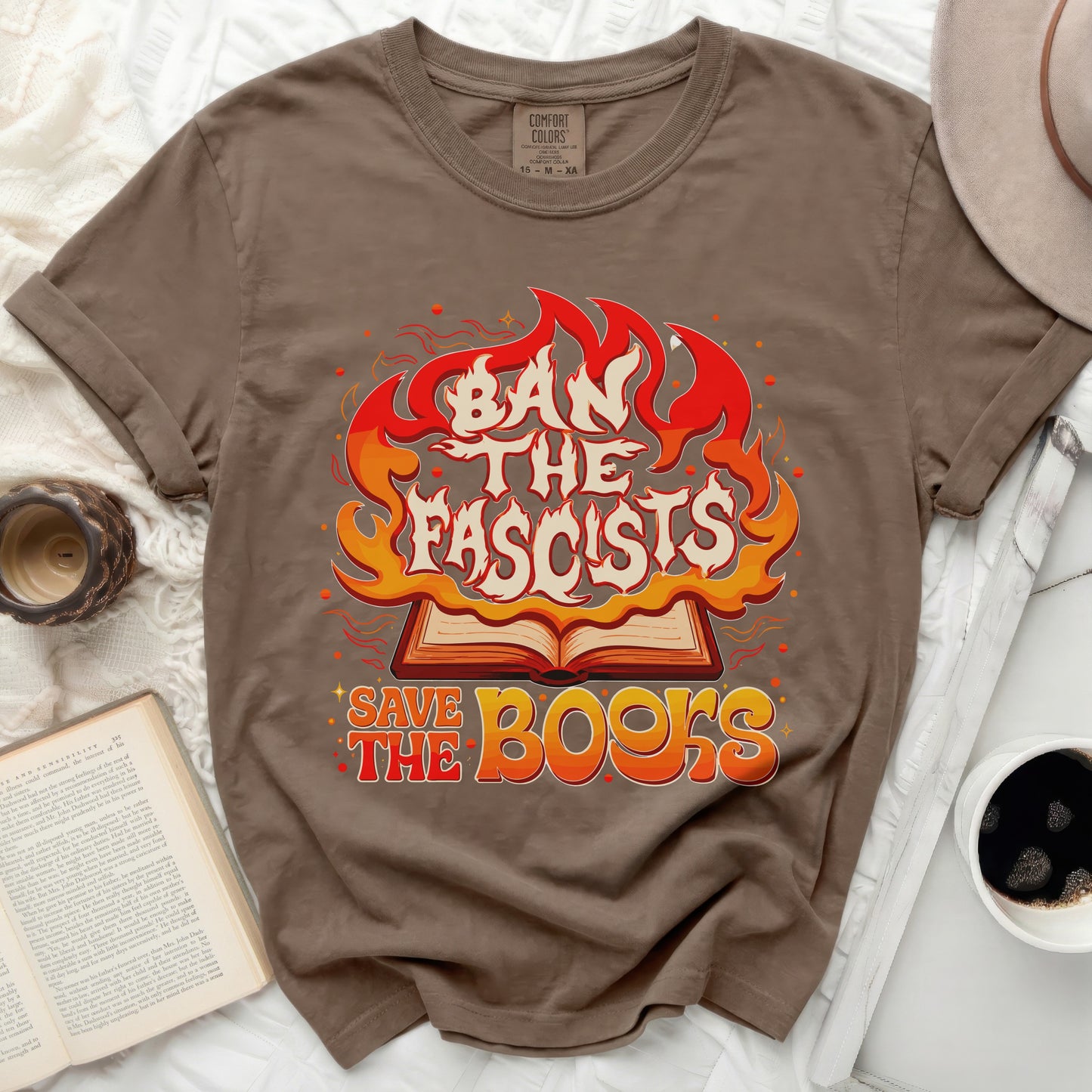 Brown t-shirt with "Ban The Fascists Save The Books" graphic.