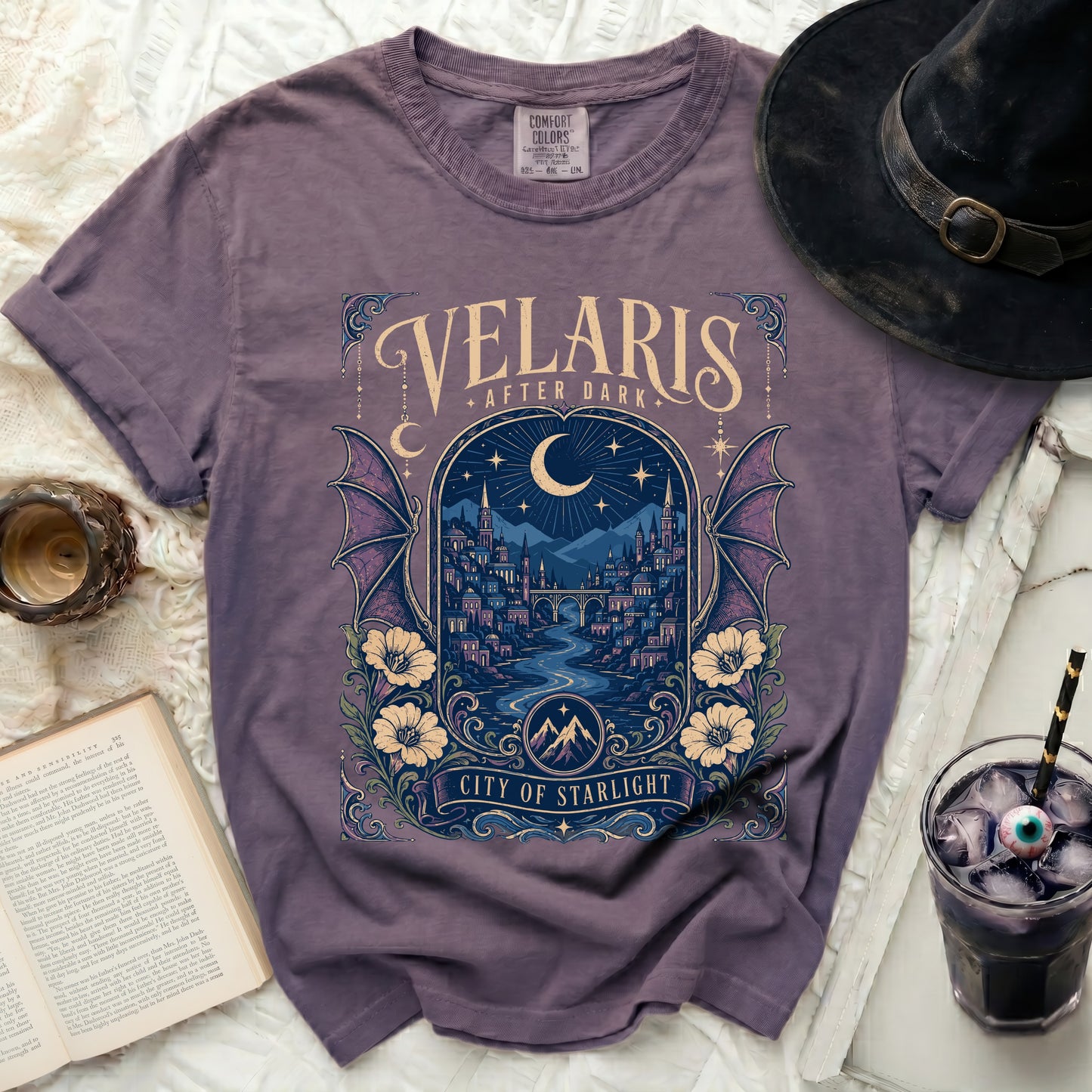 Purple t-shirt with "Velaris After Dark City of Starlight" graphic.