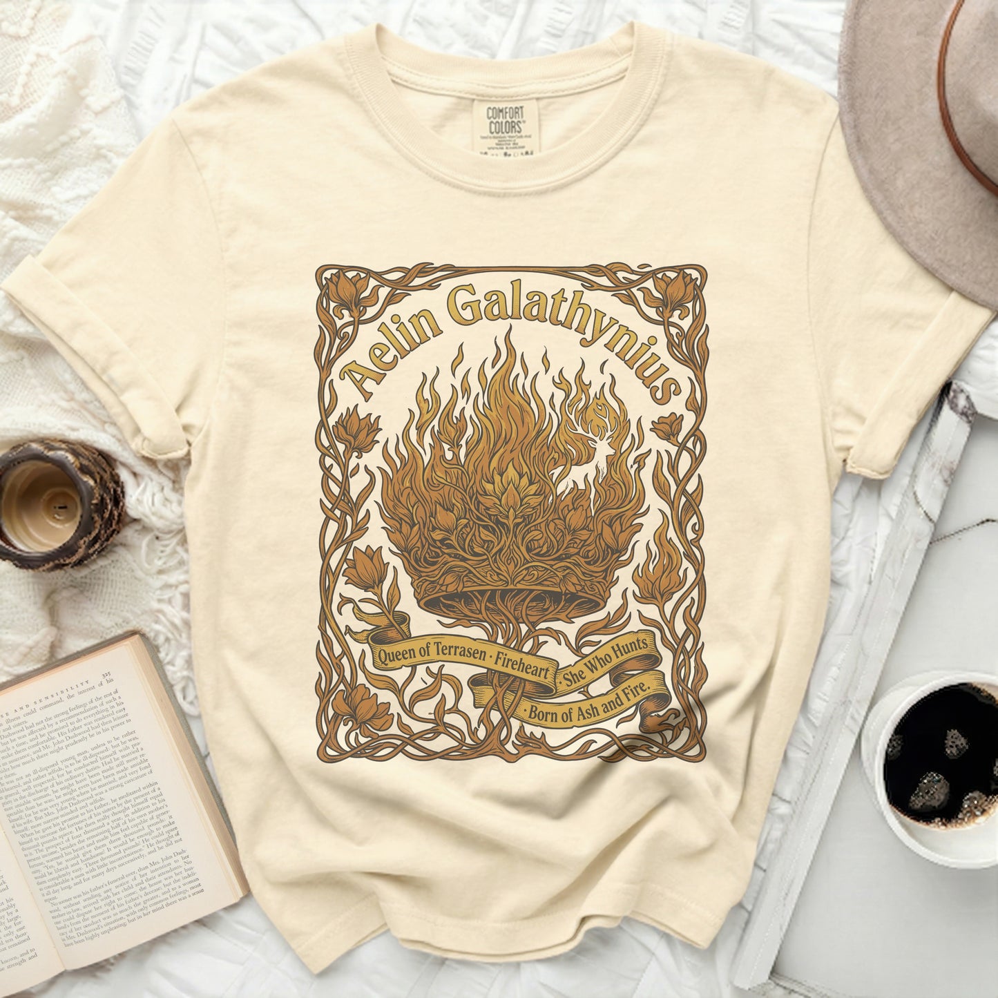 Cream t-shirt with "Aelin Galathynius" and "Queen of Terrasen Fireheart" text.