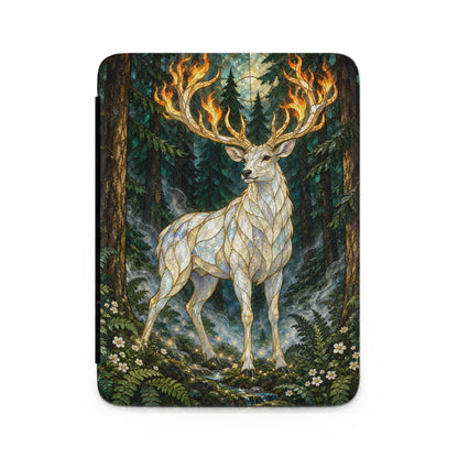 White stag with flaming antlers stands in a mystical forest with a moonlit sky.