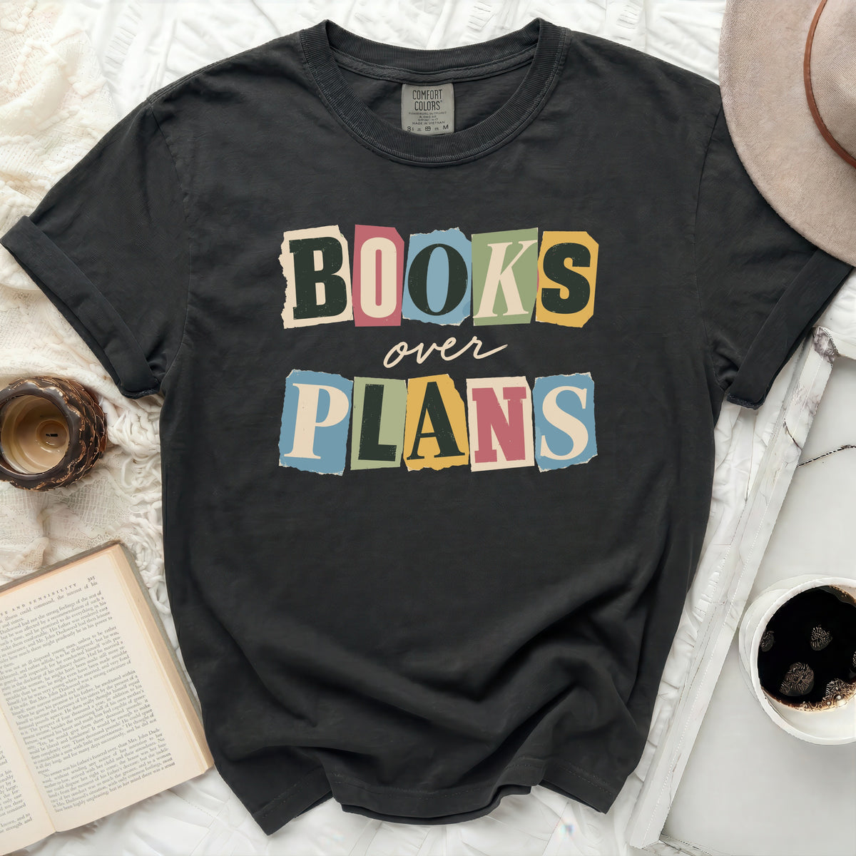 Charcoal t-shirt with "BOOKS over PLANS" in colorful cut-out letters.