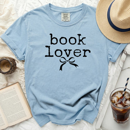 Light blue t-shirt with "book lover" text and bow graphic.
