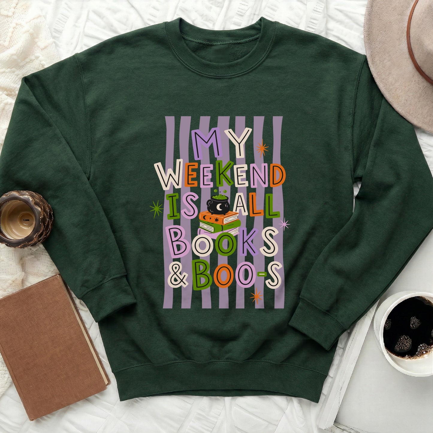 Dark green sweatshirt with "My weekend is all books & boos" text design.