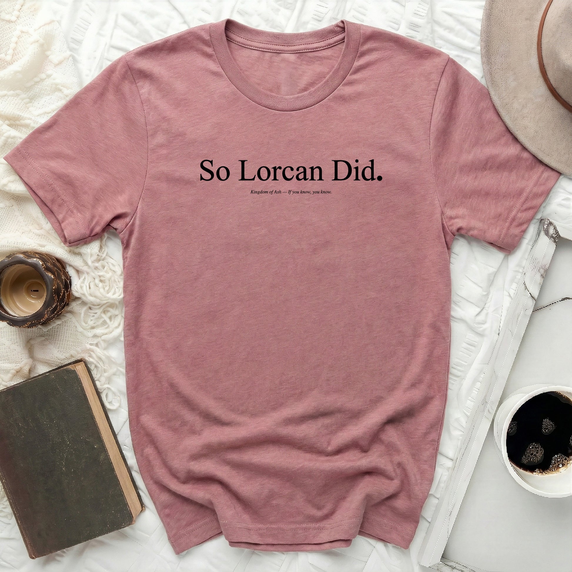 Dusty rose t-shirt with "So Lorcan Did." and "Kingdom of Ash" text.
