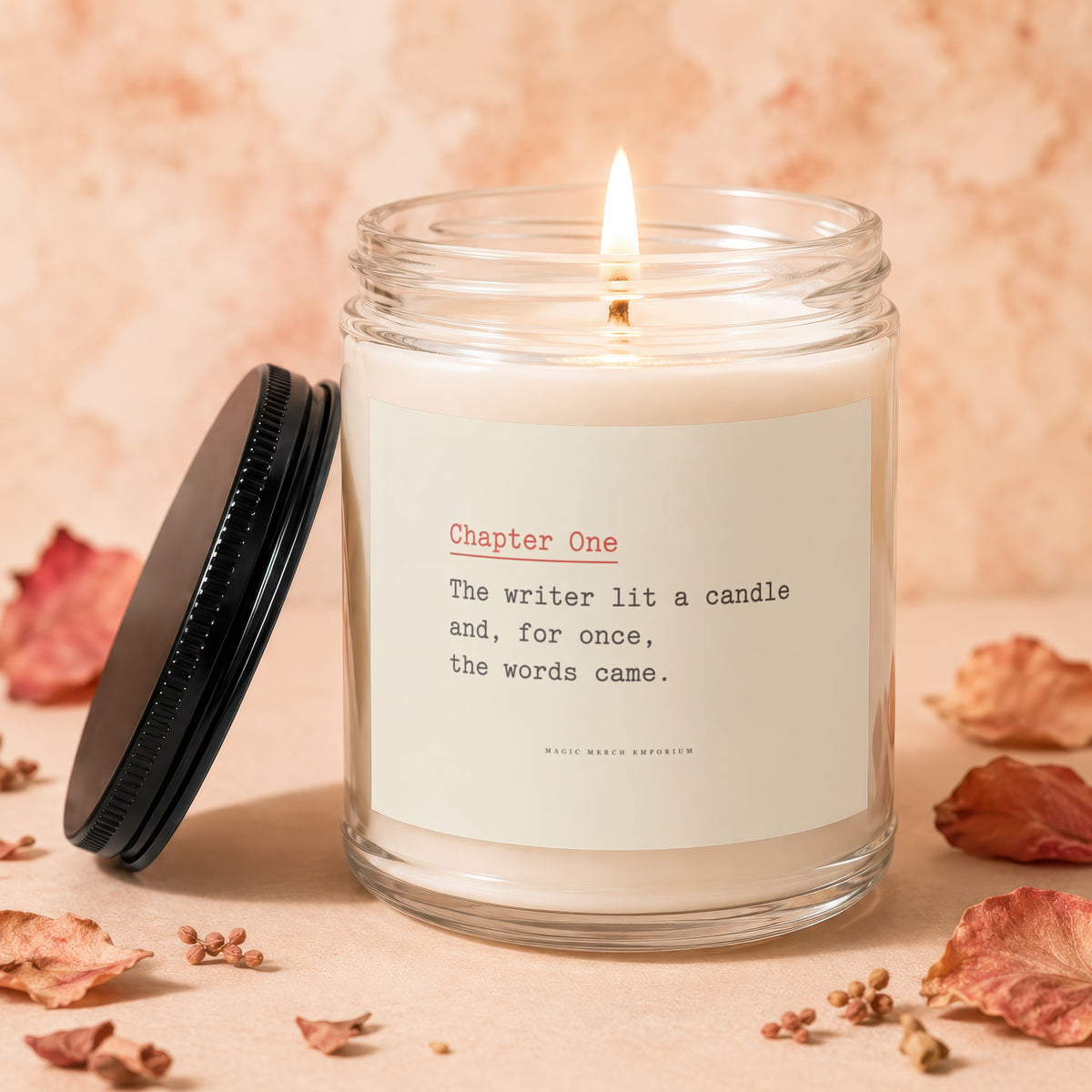 Candle with lit wick, black lid, and text "Chapter One" and "The writer lit a candle".